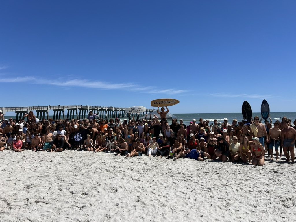hundreds of people at an out the back beach day