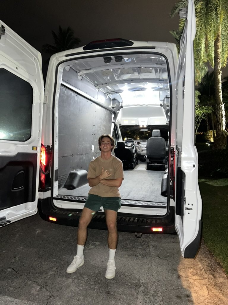 dalen in front of an empty cargo van